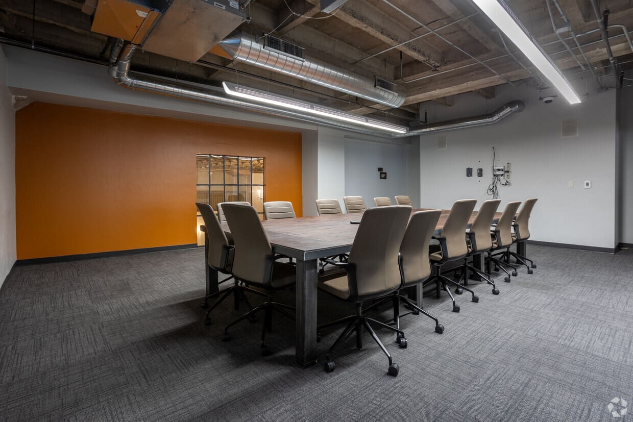 A large conference room with chairs and tables.