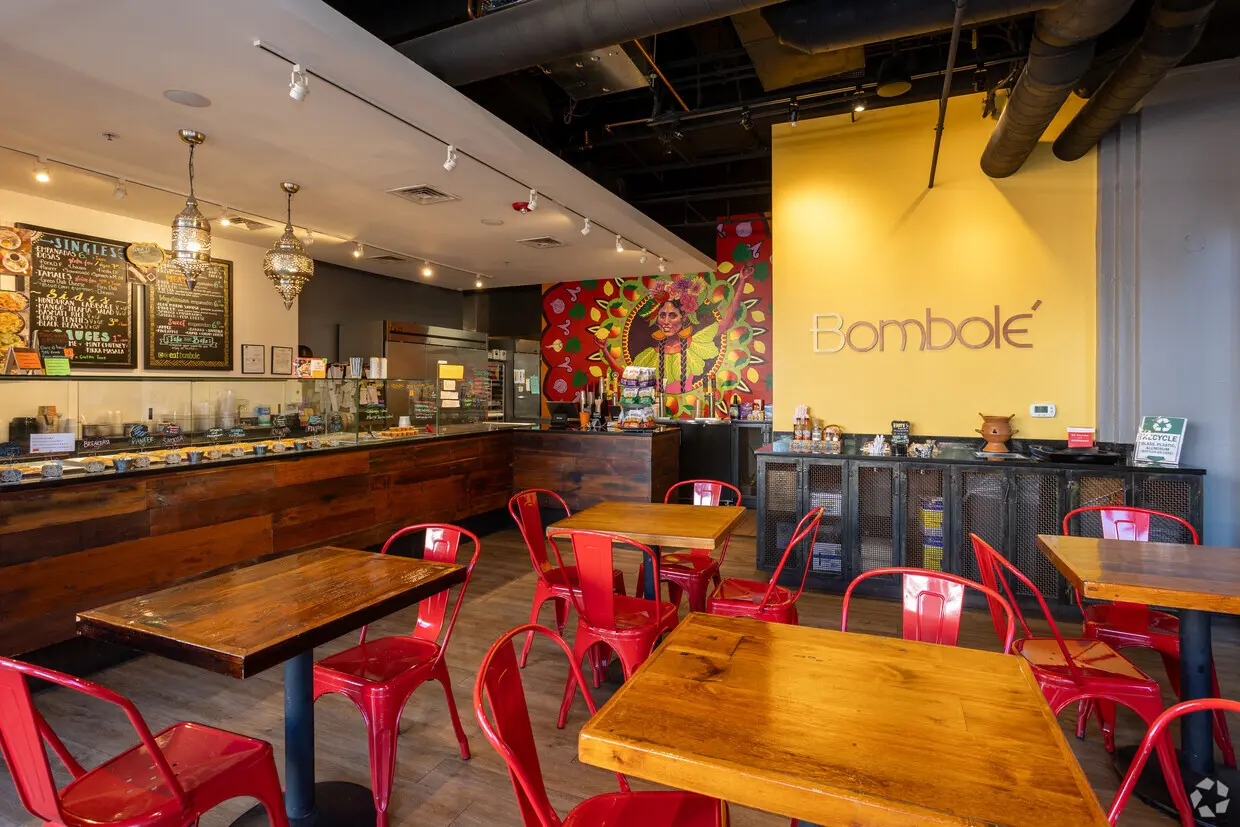 A restaurant with tables and chairs in it