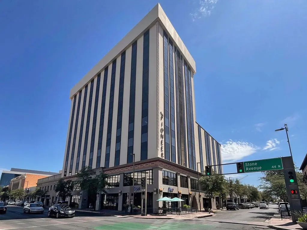 A large building with a tall tower on the top of it.